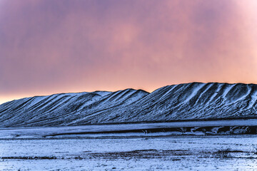 sunset in the mountains with snow iceland