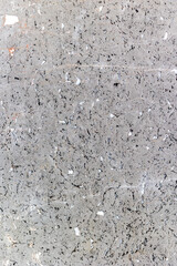 Textured gray marble surface with black and white veining patterns