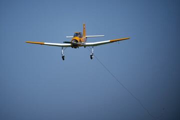 Aircraft in Flight Captured from Below Against a Clear Blue Sky