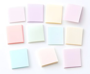 Fototapeta premium Pastel Colored Blank Notepads Arranged on White Background