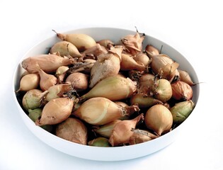 small onions in a bowl close up