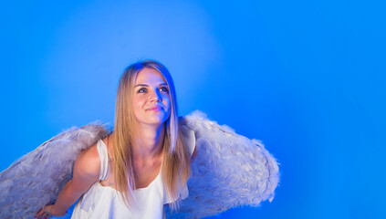 Valentines angel woman with angelic wings. Cupid woman at Valentine's Day party. Valentines angel...