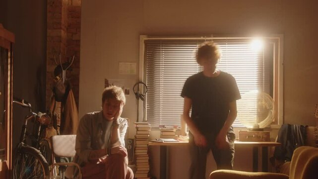 Young unhappy couple walking around sunlit living room, expressing their points and blaming each other, having emotional argument during day at home. Time lapse video