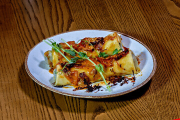 A plate of food on a wooden table
