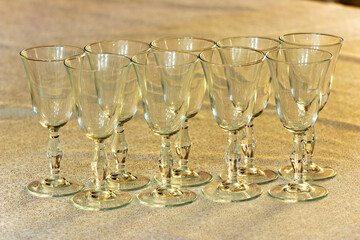 A bunch of empty wine glasses sitting on a table