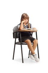 Sad pupil in a school chair