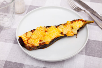 Worldwide popular dish is stuffed eggplant, with cheese baked on top. Close-up image