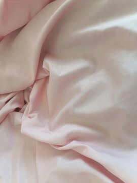 Silk Texture Unveiled Crumpled Light Pink Fabric Close-Up