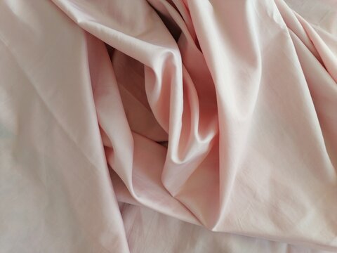 A Crumpled Light Pink Fabric Close-Up