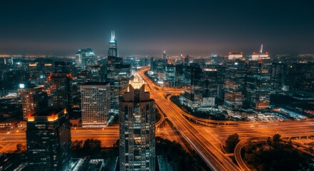 Obraz premium City at night with a tall building in the middle