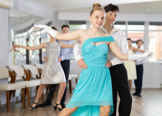 Pair dances - girls and guys in festive attire dance tango or samba
