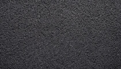 Fototapeta premium Dark Asphalt Texture: A Close-Up View of Rough Road Surface