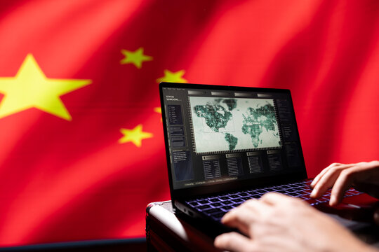 Military agent isolated over Chinese flag engaged in surveillance mission using laptop, looking at aerial map of conflict zone. Communist party regime intelligence officer monitoring zone of interest