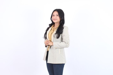 Woman in a gray blazer and black pants is smiling. Business asian woman