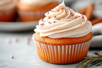 Delicious cupcake with creamy frosting and decorative sprinkles displayed on a festive background