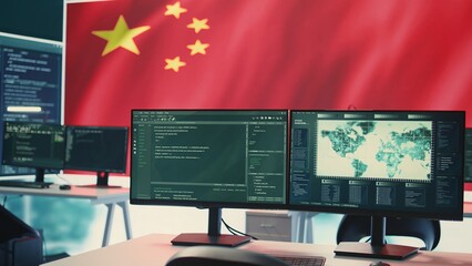 Governmental cyber operations room with Chinese flag on big screen, representing cyber espionage...