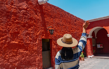 Latin tourist visits the Monastery of Santa Catalina on a sunny day, Arequipa, Peru