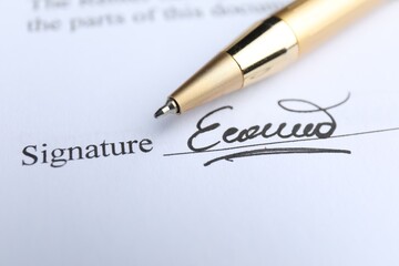 Ballpoint pen and signature on contract, closeup