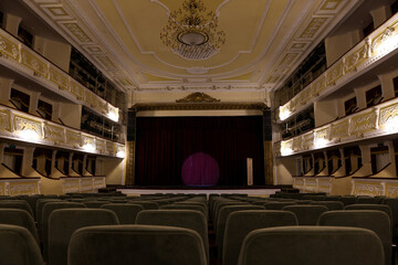 Theatre interior with stage and rows of comfortable seats