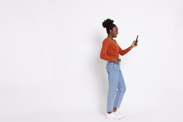 Happy woman with smartphone on white background. Space for text