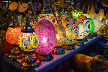 Shop of Arabic style lamps in different colors illuminated at Marrakech