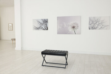 Interior of modern art gallery with beautiful paintings