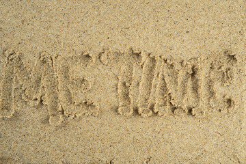 word me time written on the beach sand