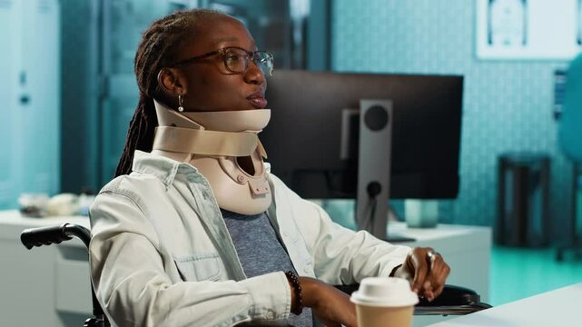 African american patient wears a cervical collar during checkup with physician, wheelchair user dealing with a fractured neck vertebra. The road to spinal recovery with expert medic. Camera A.