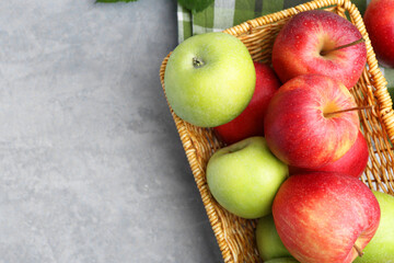 Fresh ripe apples on grey table, top view. Space for text