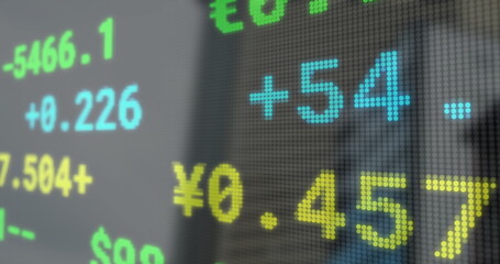 Image of financial data processing over cityscape