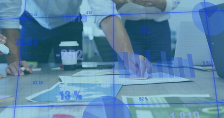 Image of data processing and diagrams over diverse business people discussing work