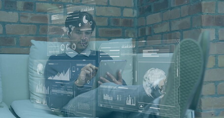 Image of data processing and diagrams over caucasian businessman using tablet