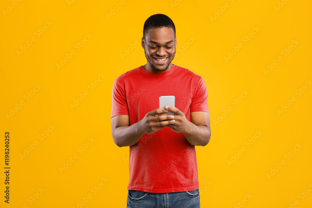Poster smiling black man using smartphone browsing internet and scrolling social media news feed standing o
