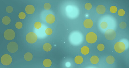 Yellow circles image over blue bokeh background
