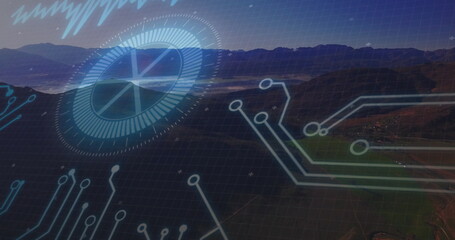 Circuit board and digital interface image over mountainous landscape