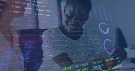 Image of financial data processing over diverse business people in office