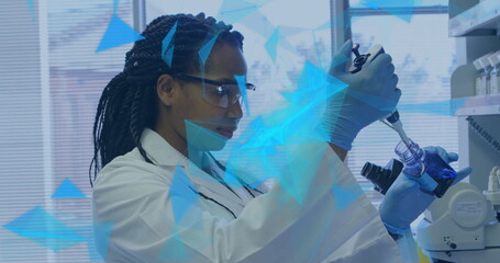 Image of network of connections over african american female scientist in laboratory