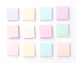 Fototapeta premium Twelve pastel colored sticky notes arranged in a grid