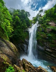 Serene waterfall cascading through lush greenery.