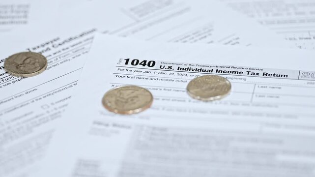 1040 Tax Form, Federal Income Tax Return, Slow Motion Coins Dropping, 4K Video Close-Up
