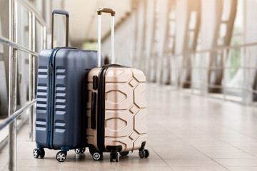 Travel Fashion. Closeup Shot Of Two Plastic Suitcases Standing At Empty Airport Corridor, Stylish...