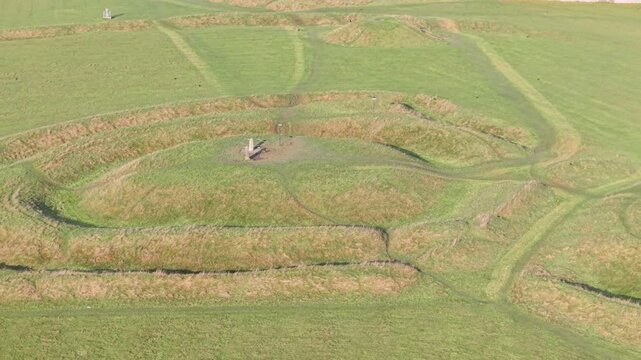 Lia Fail (Stone of Destiny) At The Hill Of Tara Surrounded By Green Landscape In County Meath, Ireland. - aerial shot