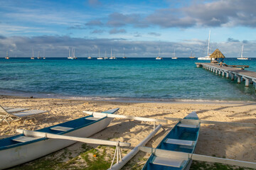 French Polynesia, Rangiroa Atoll. Outrigger boats on beach and ocean dock.