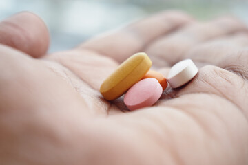 A Wide Variety of Pills Held in Hand, Essential for Health or Medication
