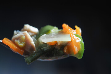 A Vibrant and Colorful Medley of Mixed Vegetables Served on a Spoon