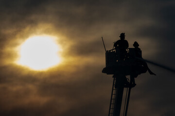 Firefighters spray water 
