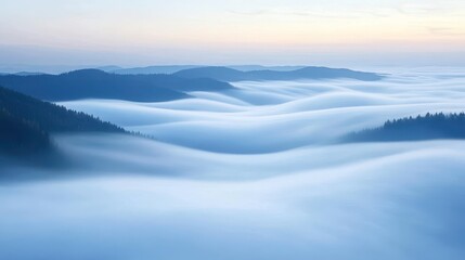 Obraz premium Serene Landscape of Rolling Misty Mountains at Dawn with Soft Blue Tones and Gentle Light Creating a Dreamy Atmosphere in Nature’s Tranquility