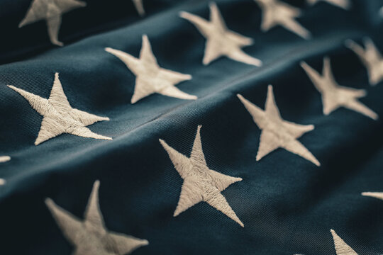 abstract full frame white embroidered stars on American United States navy flag patriotic elegant background