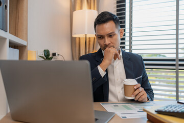 Fototapeta premium Burnout is killing his career, businessman experiencing stress during a day at work, exhausted man in office, headache, stress and tired businessman, debt crisis and eye strain problem