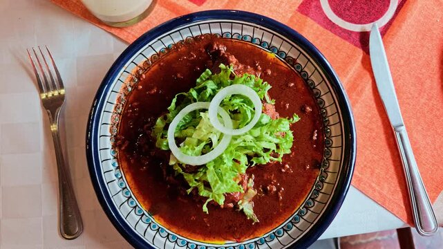 Chanclas poblanas or Chorizo Sandwiches With Tomato-Guajillo Salsa, traditional mexican food in a restaurant